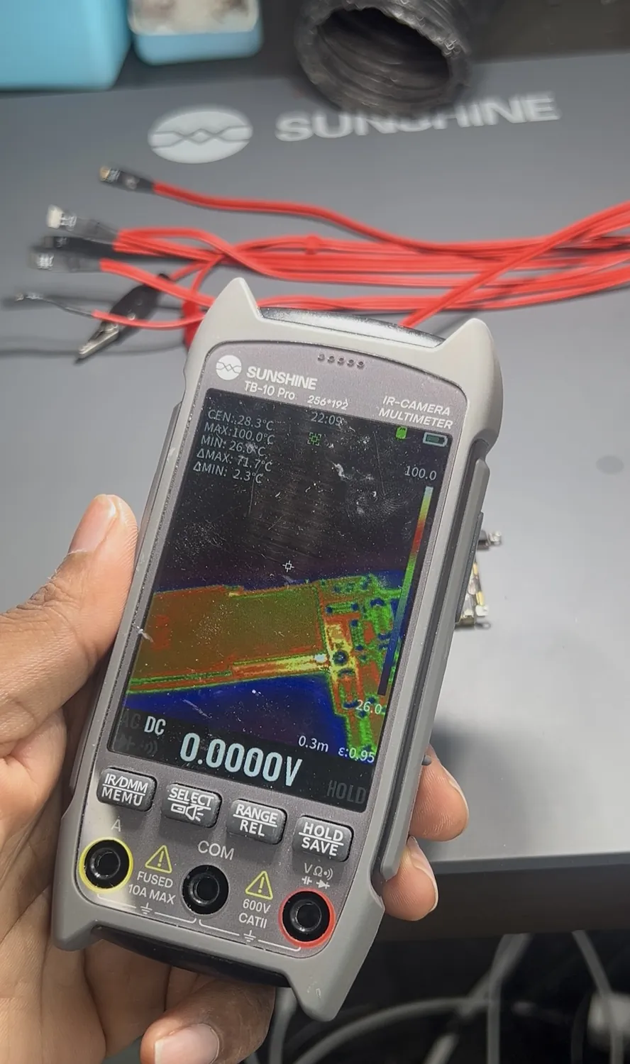 Thermal camera locating the hot shorted capacitor on an iPhone 13 logic board