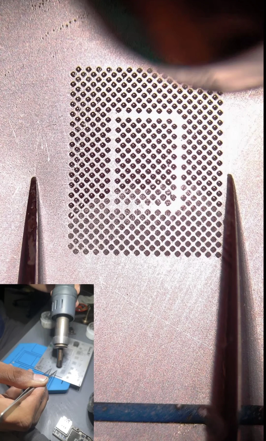 iPhone 14 Pro Max baseband processor in a reballing stencil with a fresh grid of solder balls