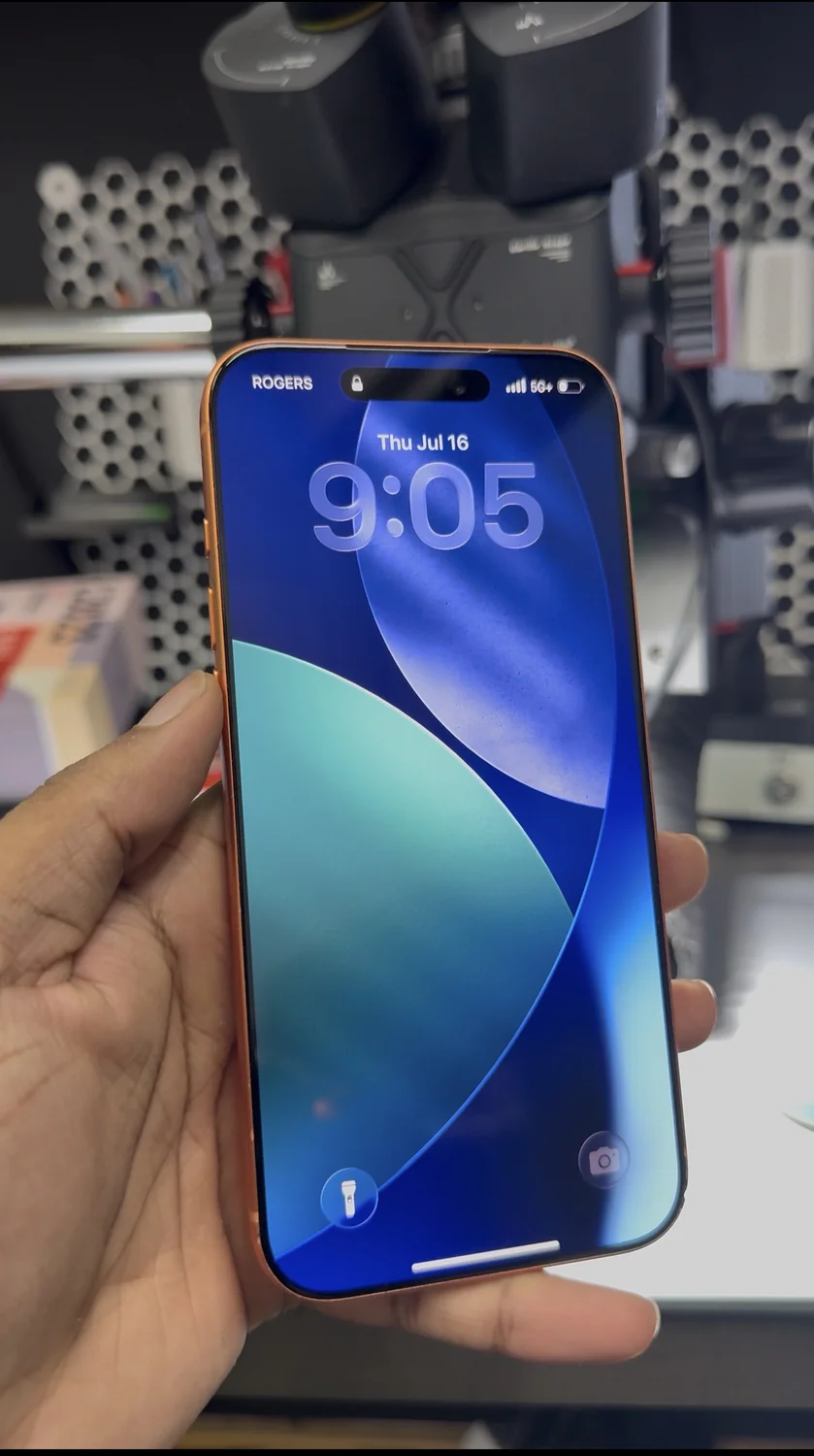 Repaired iPhone 17 Pro Max powered on with new glass over its original display