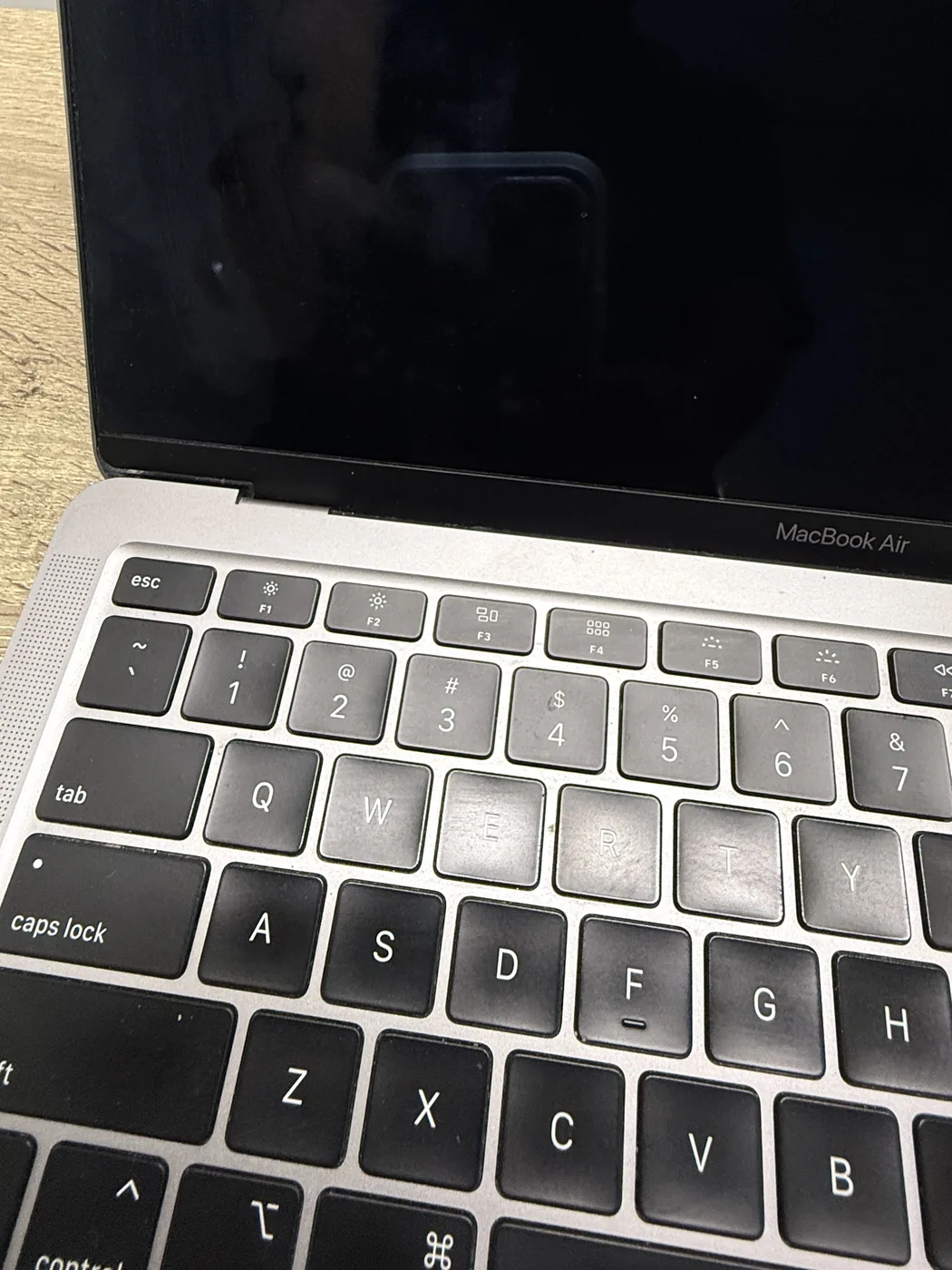 MacBook Air with the bezel repaired, showing a clean edge with no crack
