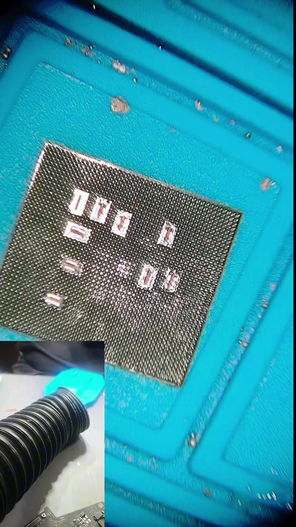 Galaxy S23 Ultra processor in a reballing stencil with a fresh grid of solder balls across its underside