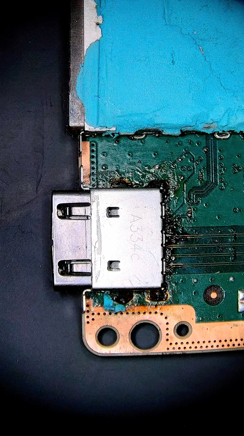 The badly-installed Xbox HDMI port lifted off, exposing the contaminated footprint